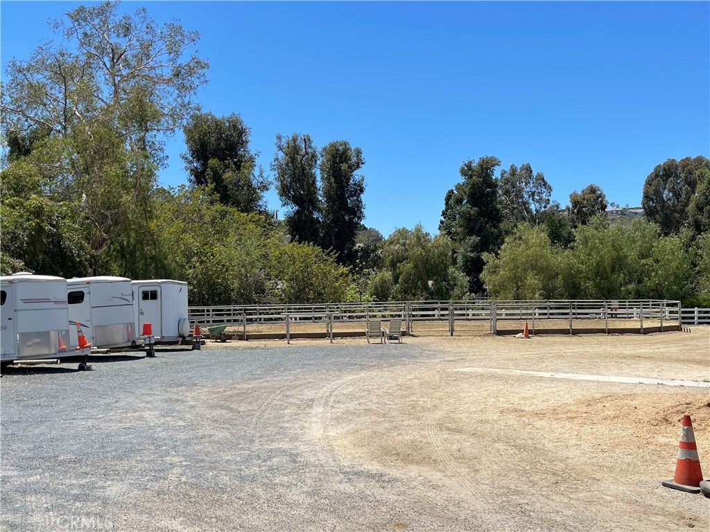 654 North Buttonbush Trail Orange, CA 92869 - Photo 23 of 23 a view of a swimming pool with a yard and palm trees