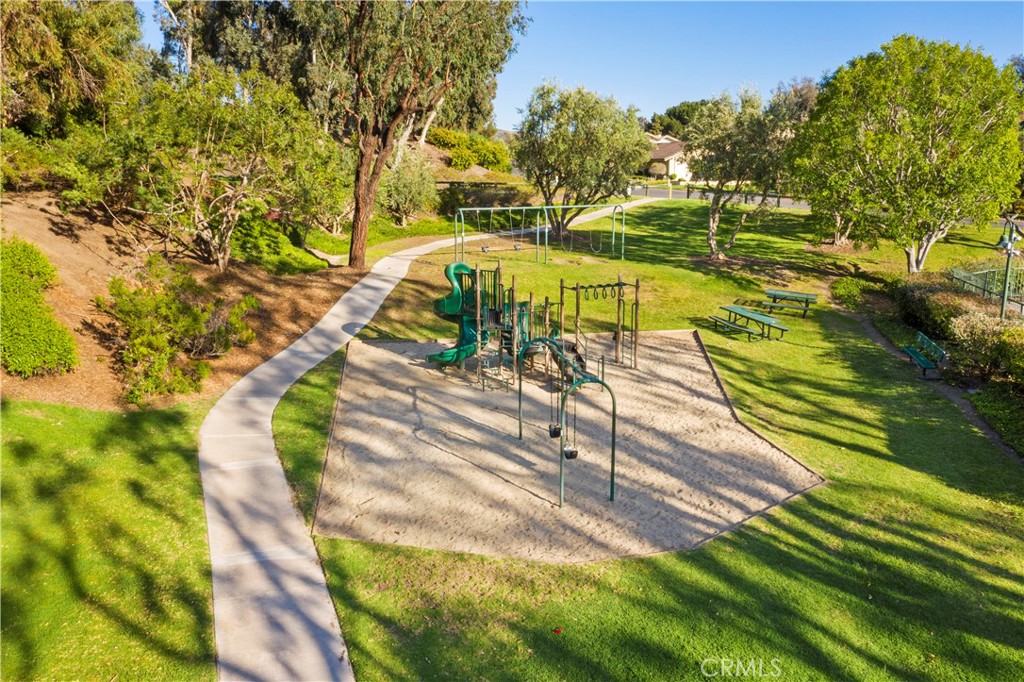 654 North Buttonbush Trail Orange, CA 92869 - Photo 4 of 23 a view of a yard with swimming pool