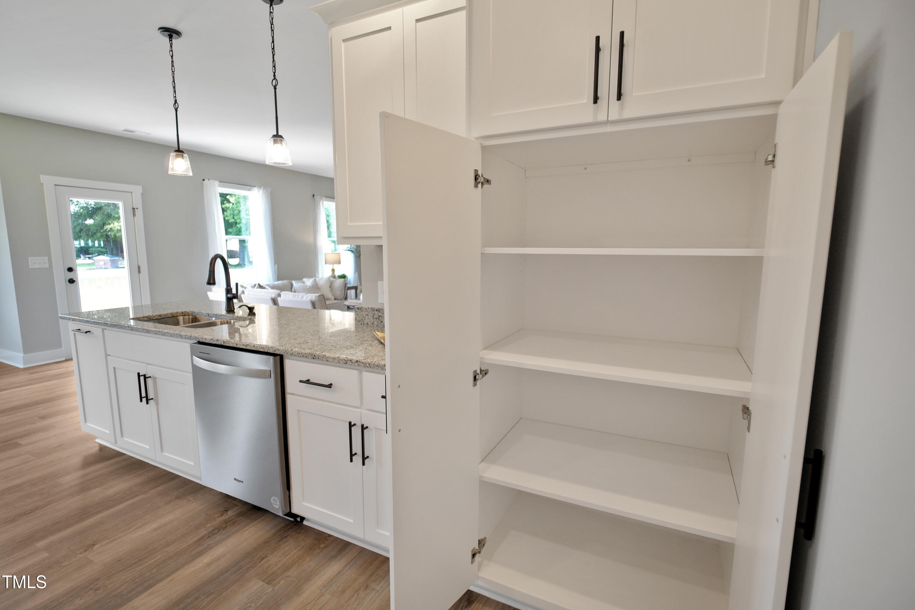 101 Sand Trap Lane Clinton, NC 28328 - Photo 14 of 49 a kitchen with white cabinets and white appliances
