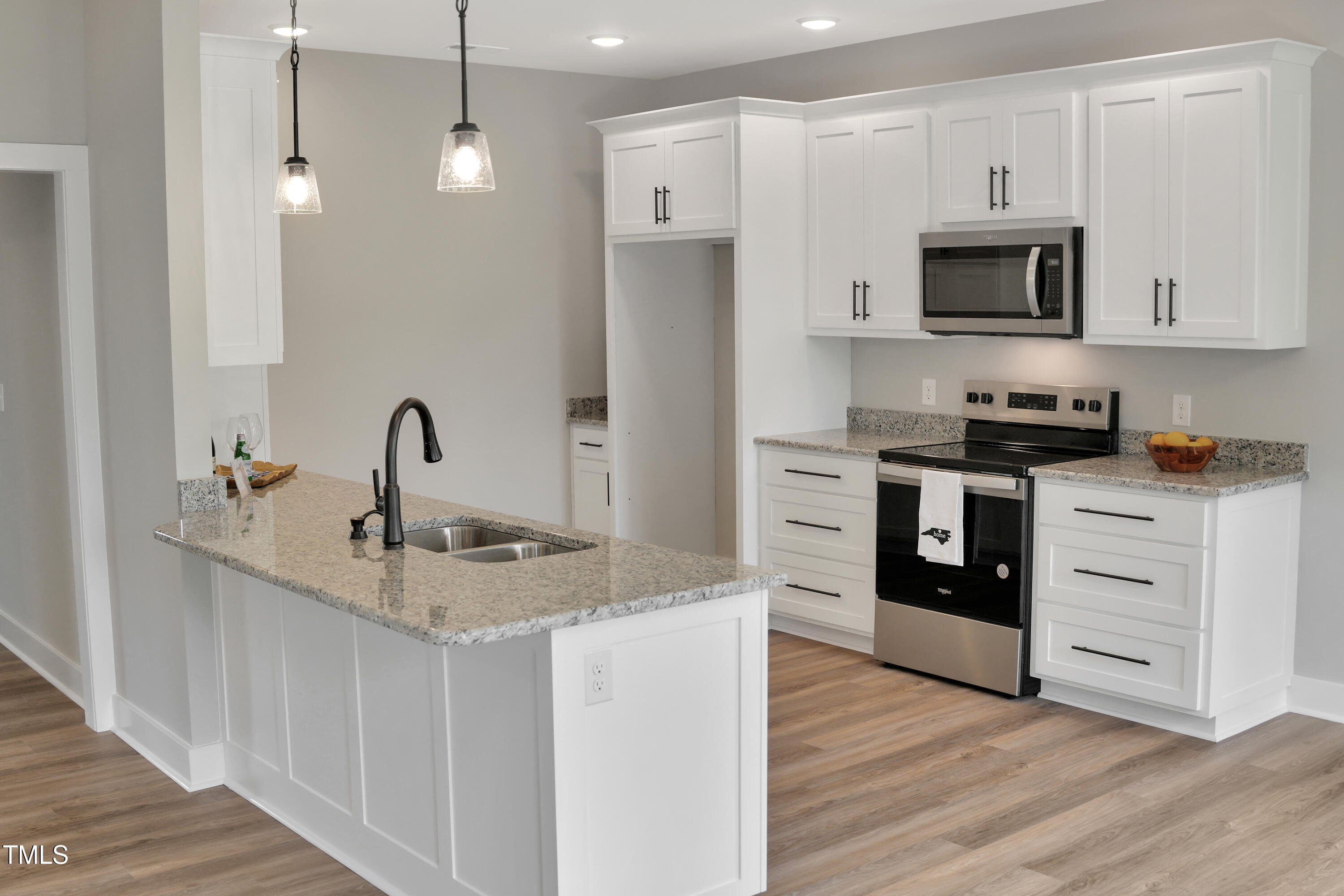 101 Sand Trap Lane Clinton, NC 28328 - Photo 16 of 49 a kitchen with stainless steel appliances granite countertop a sink stove and refrigerator