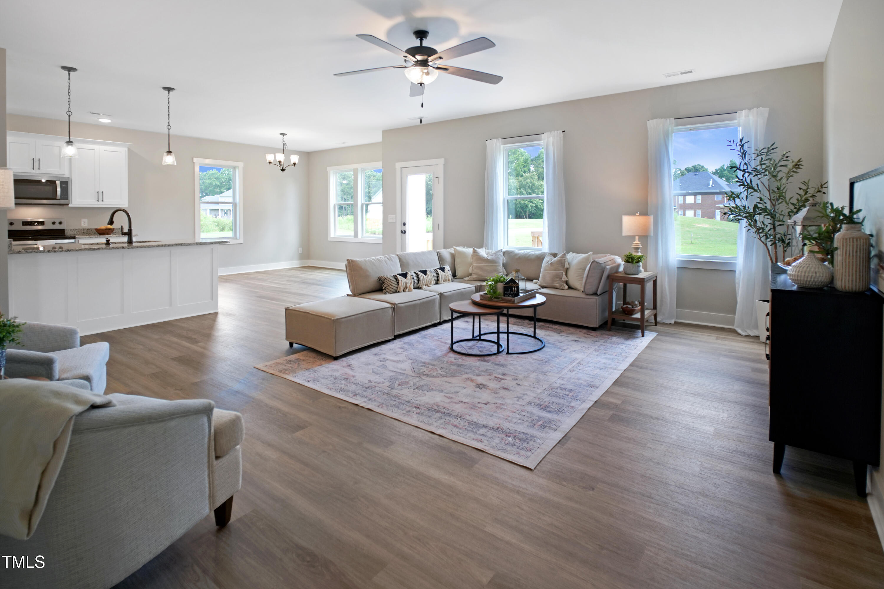 101 Sand Trap Lane Clinton, NC 28328 - Photo 19 of 49 a living room with furniture hard wood floor and a fireplace