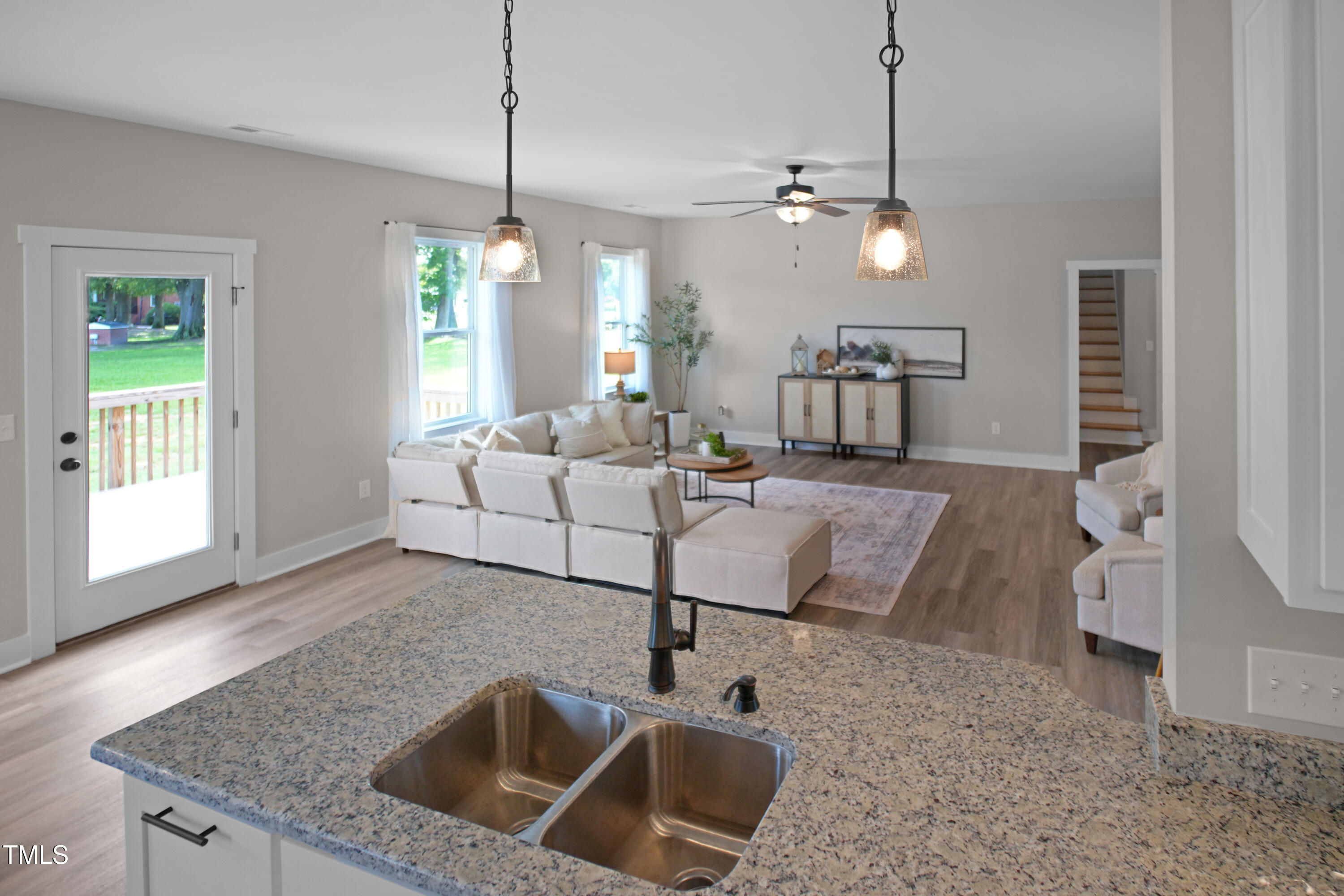 101 Sand Trap Lane Clinton, NC 28328 - Photo 21 of 49 a living room with furniture and a chandelier