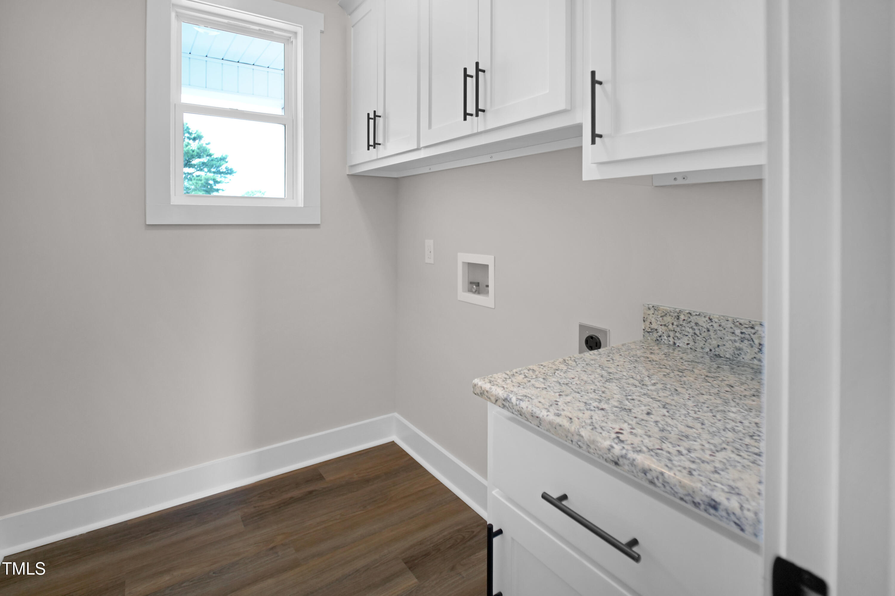 101 Sand Trap Lane Clinton, NC 28328 - Photo 26 of 49 a view of kitchen cabinets and wooden floor