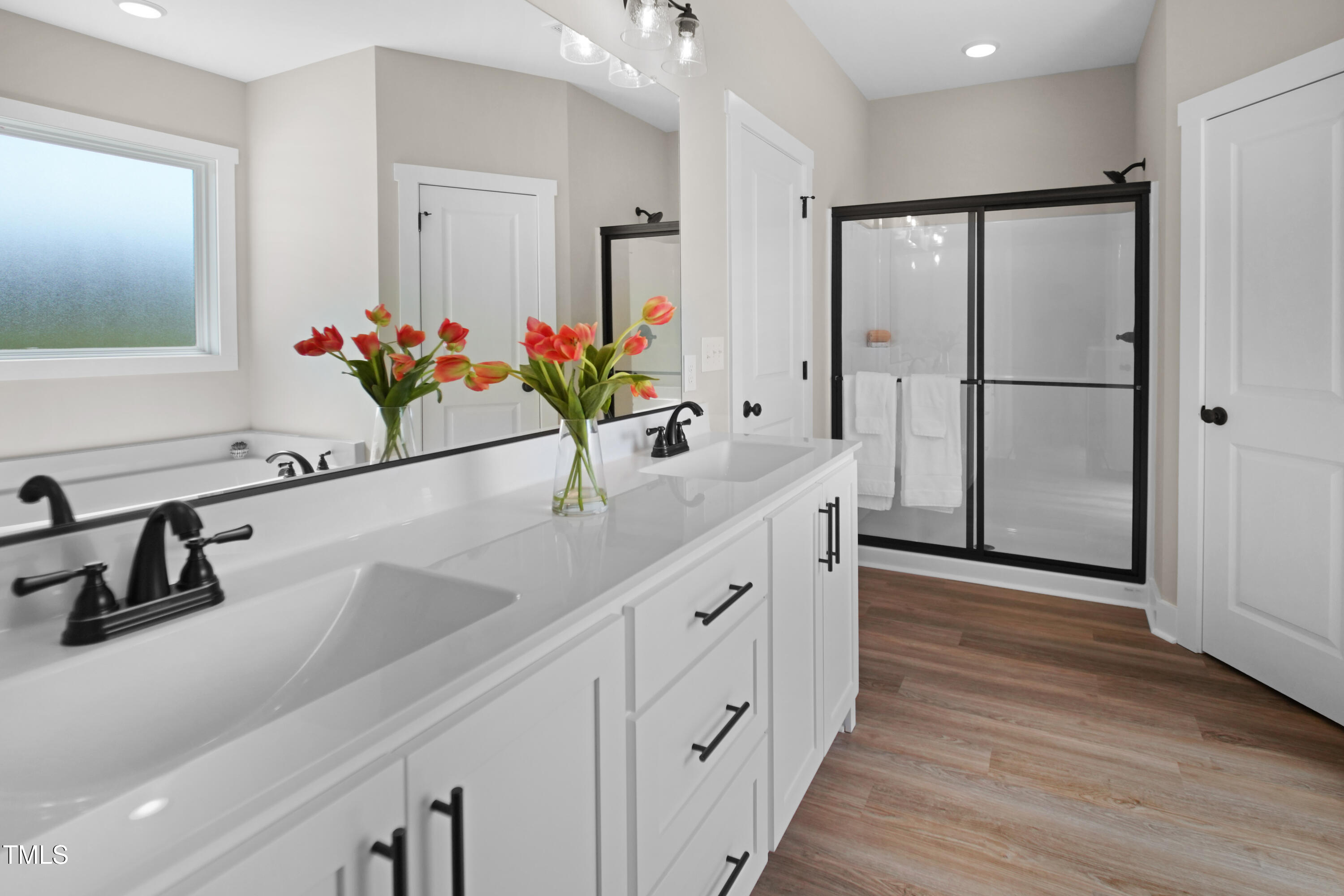 101 Sand Trap Lane Clinton, NC 28328 - Photo 32 of 49 a bathroom with a double vanity sink and a mirror