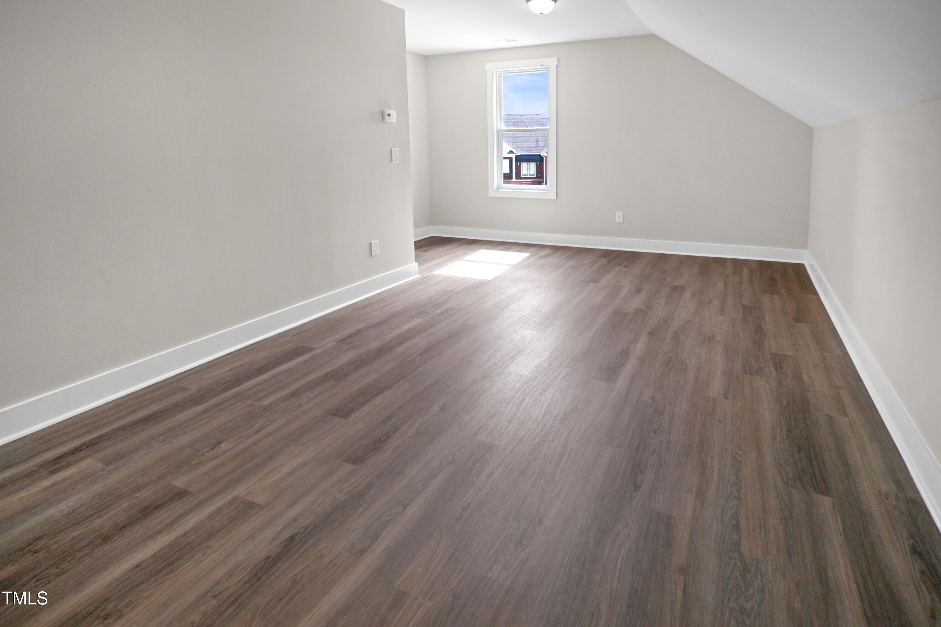 101 Sand Trap Lane Clinton, NC 28328 - Photo 37 of 49 an empty room with wooden floor and windows