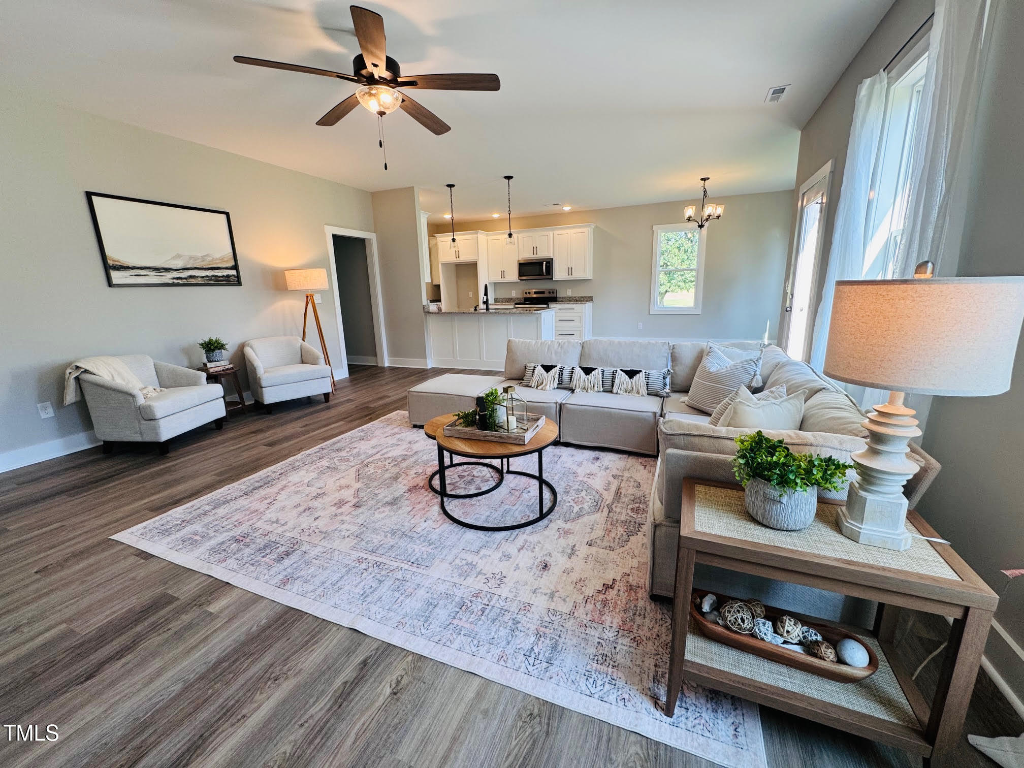 101 Sand Trap Lane Clinton, NC 28328 - Photo 4 of 49 a living room with furniture a rug and a chandelier
