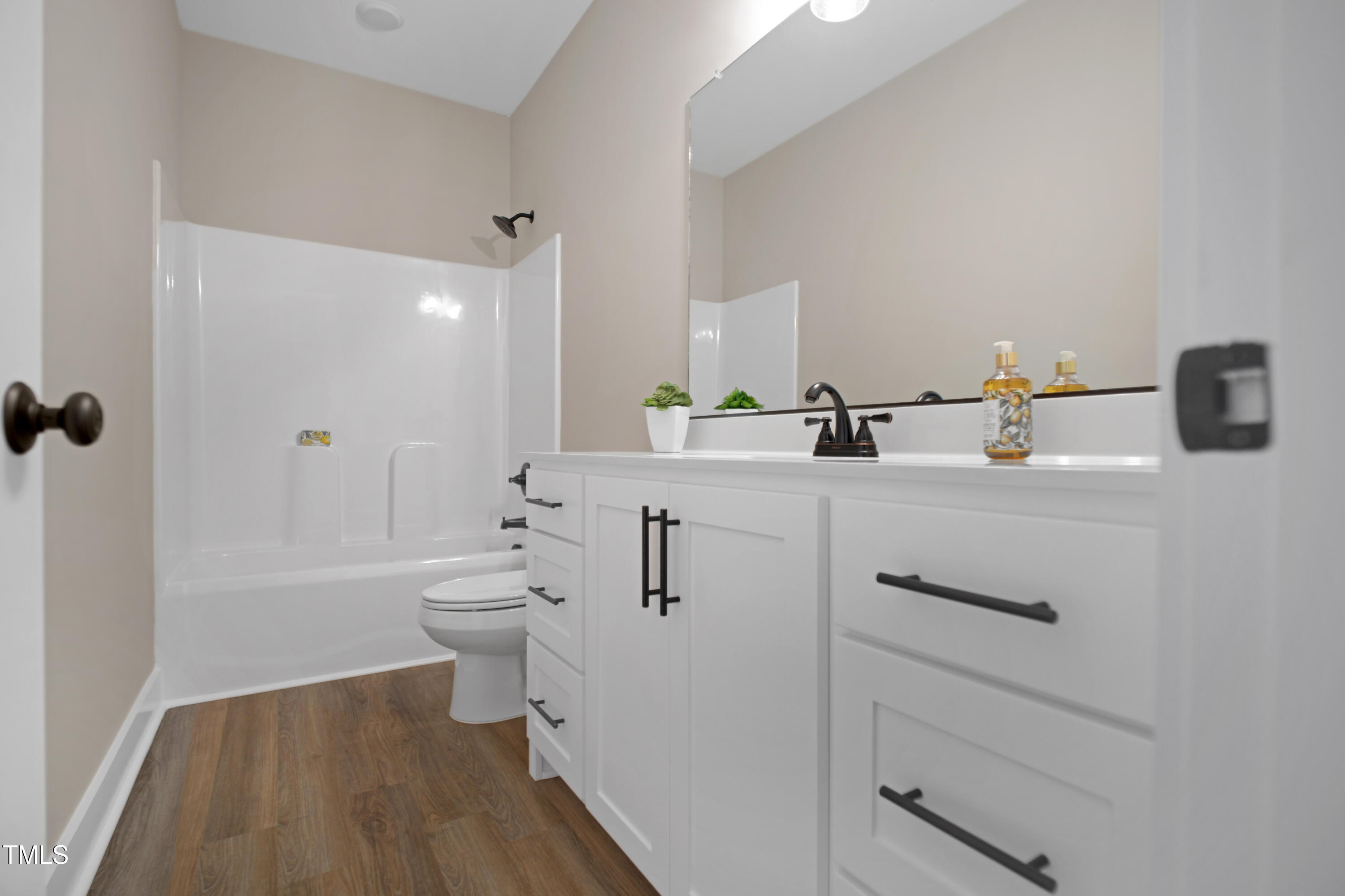 101 Sand Trap Lane Clinton, NC 28328 - Photo 42 of 49 a bathroom with a sink a toilet and shower