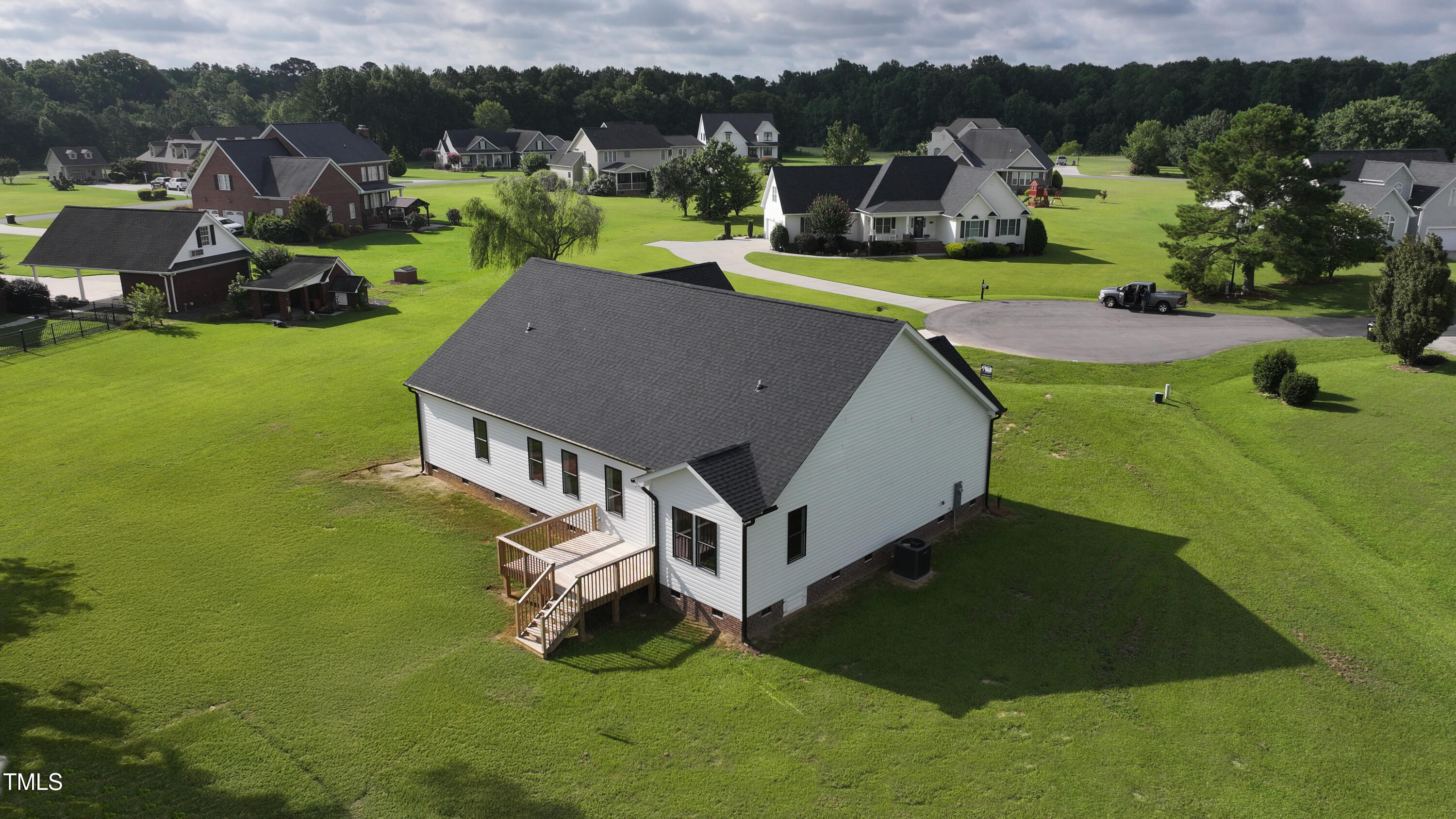 101 Sand Trap Lane Clinton, NC 28328 - Photo 48 of 49 a aerial view of a house with swimming pool garden and mountain view