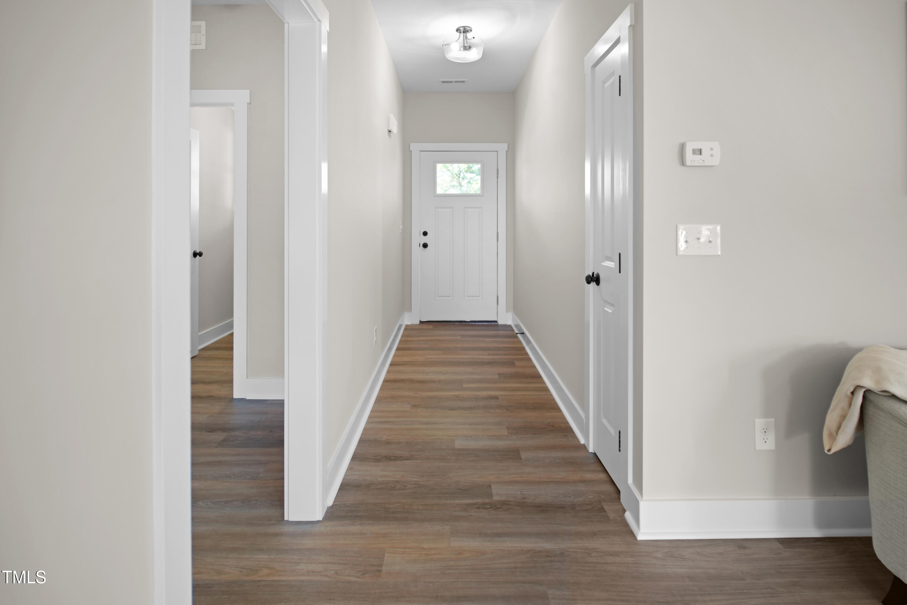 101 Sand Trap Lane Clinton, NC 28328 - Photo 10 of 49 a view of a hallway with wooden floor and staircase