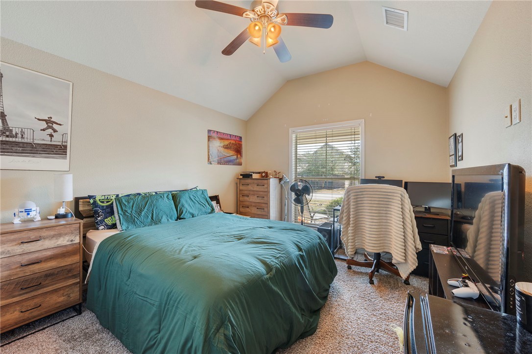 3612 Haverford Road College Station, TX 77845 - Photo 9 of 16 a bedroom with a bed a desk and chair with window