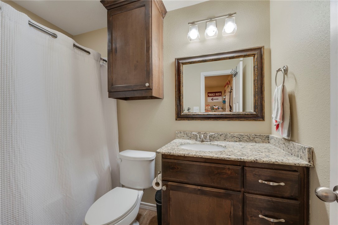 3612 Haverford Road College Station, TX 77845 - Photo 10 of 16 a bathroom with a toilet sink and mirror