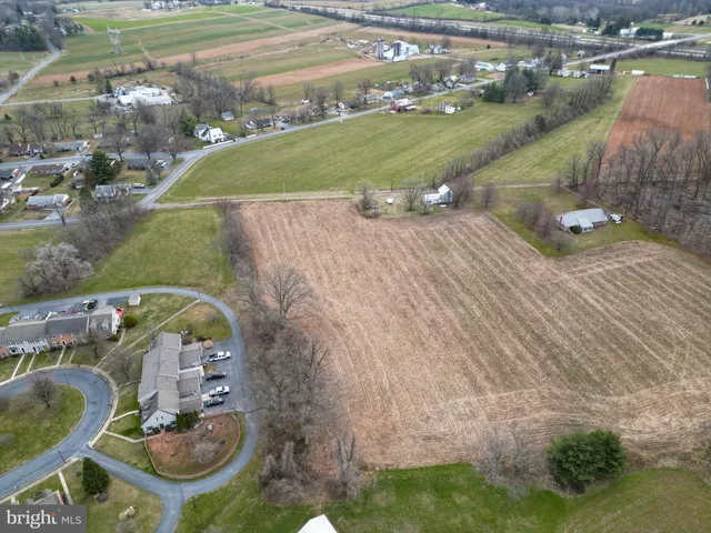 an aerial view of a house with outdoor space