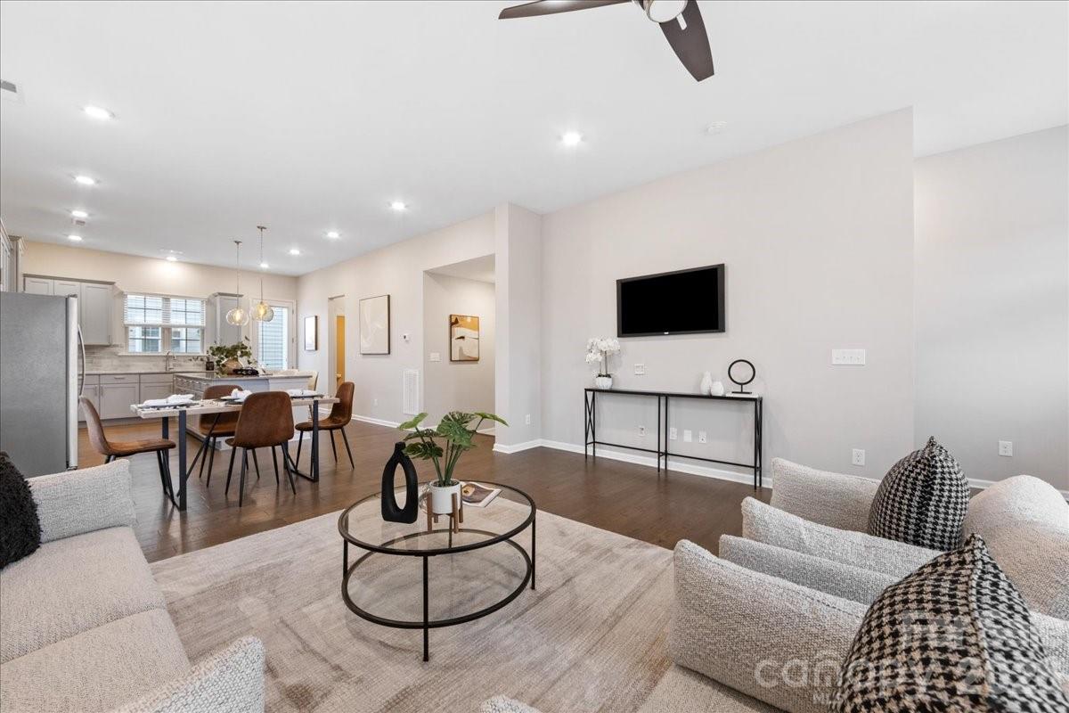 9205 Bluefield Street Charlotte, NC 28273 - Photo 11 of 48 a living room with furniture and a flat screen tv