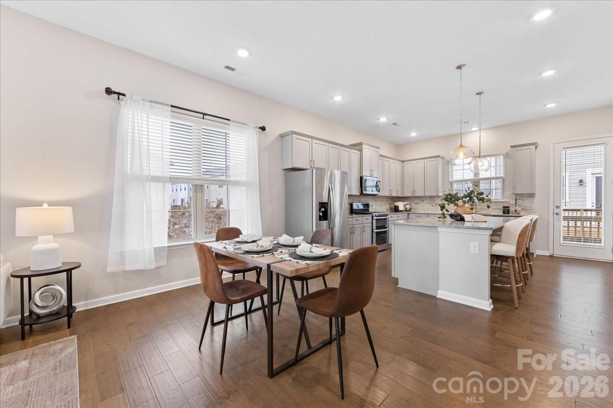 9205 Bluefield Street Charlotte, NC 28273 - Photo 13 of 48 a kitchen with kitchen island wooden cabinets and counter space