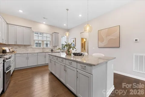 a kitchen with a sink cabinets and window