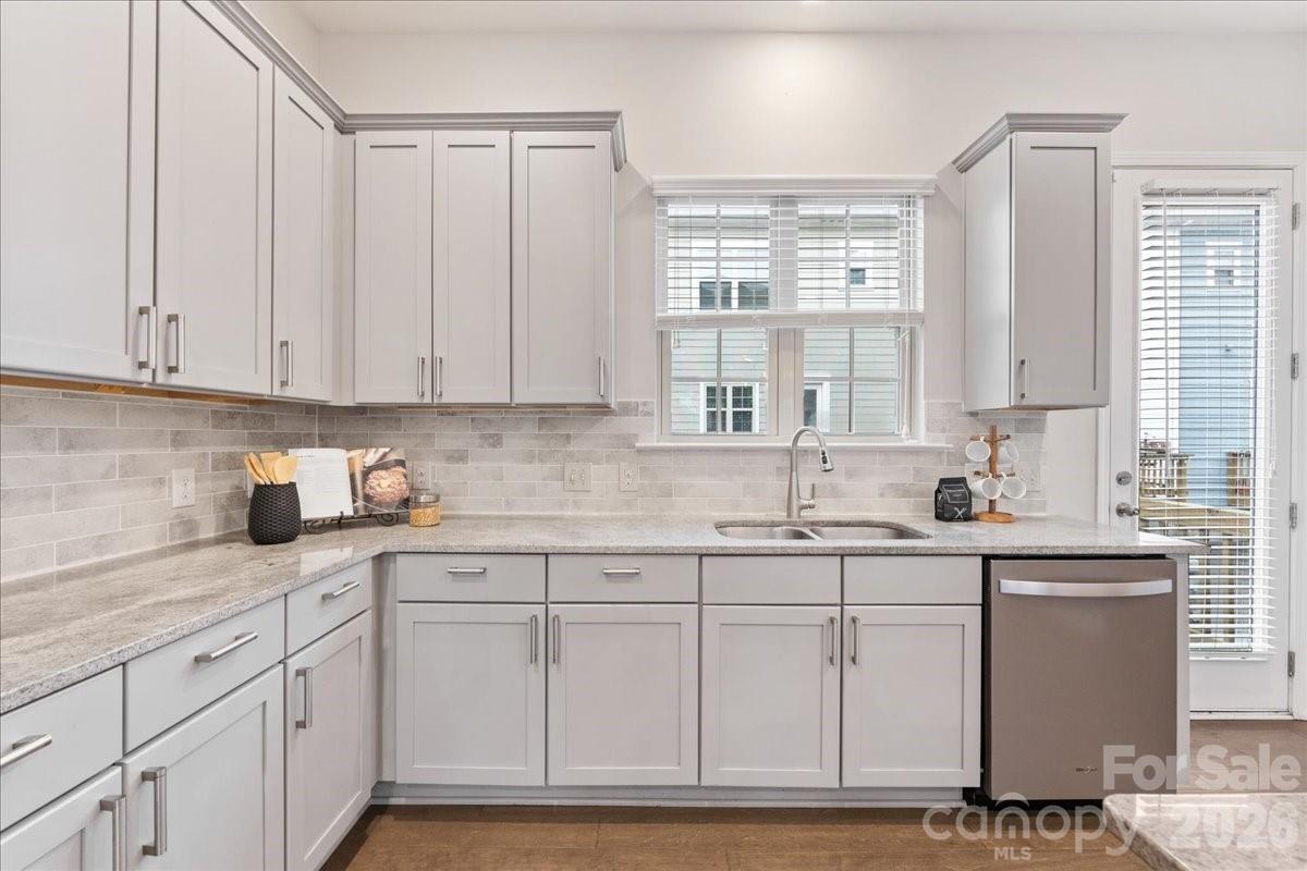 9205 Bluefield Street Charlotte, NC 28273 - Photo 19 of 48 a kitchen with white cabinets and sink