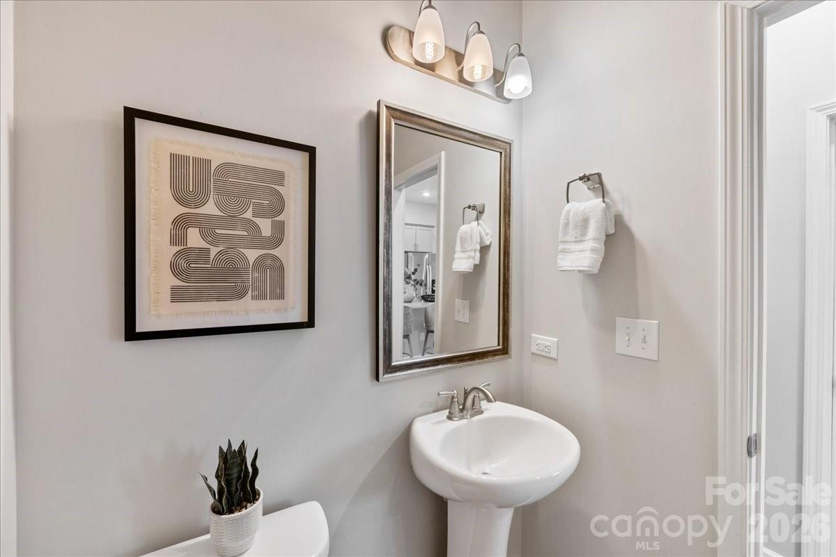 9205 Bluefield Street Charlotte, NC 28273 - Photo 22 of 48 a bathroom with a sink and a mirror
