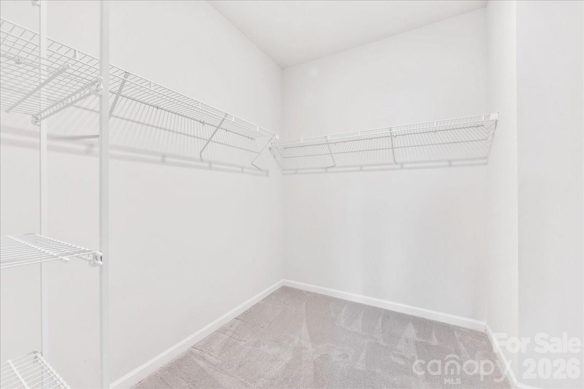 9205 Bluefield Street Charlotte, NC 28273 - Photo 32 of 48 a view of a room with racks on the wall