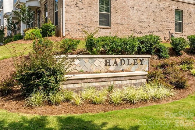 a swimming pool with outdoor seating and yard