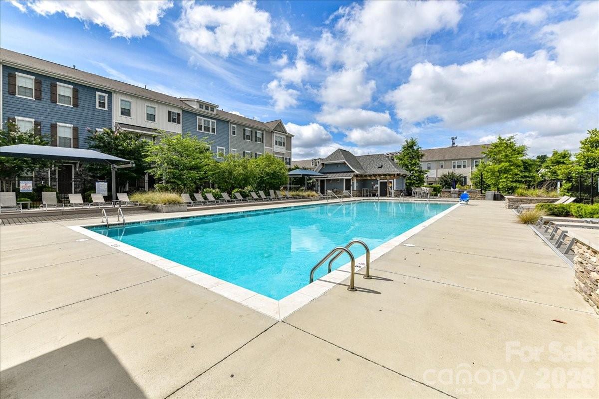 9205 Bluefield Street Charlotte, NC 28273 - Photo 43 of 48 a swimming pool with outdoor seating and yard
