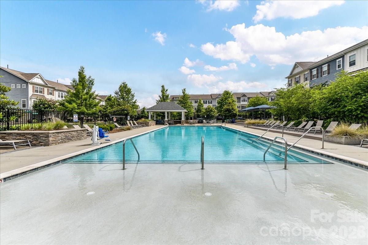 9205 Bluefield Street Charlotte, NC 28273 - Photo 47 of 48 a view of swimming pool with chairs