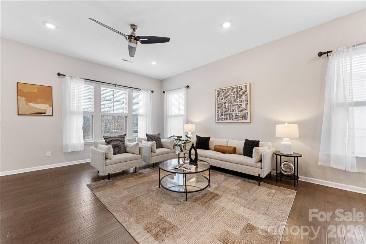 9205 Bluefield Street Charlotte, NC 28273 - Photo 9 of 48 a living room with furniture or couch and a ceiling fan