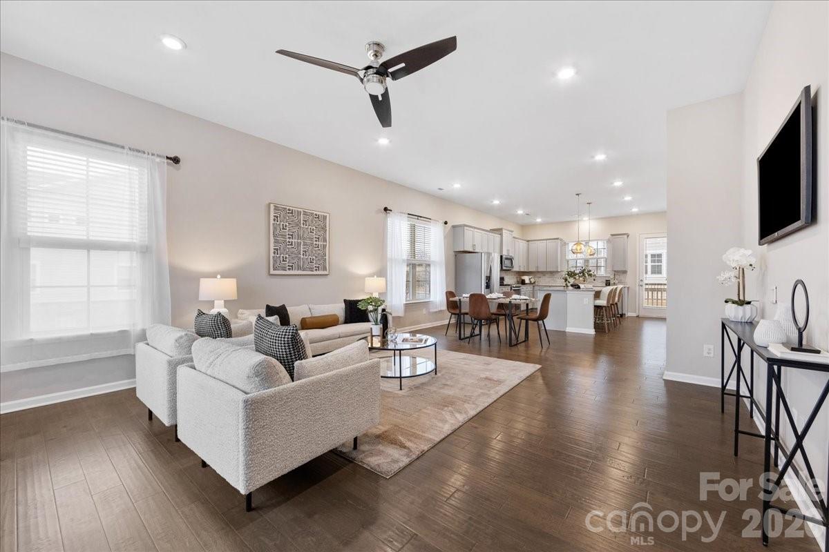 9205 Bluefield Street Charlotte, NC 28273 - Photo 10 of 48 a living room with furniture and a flat screen tv