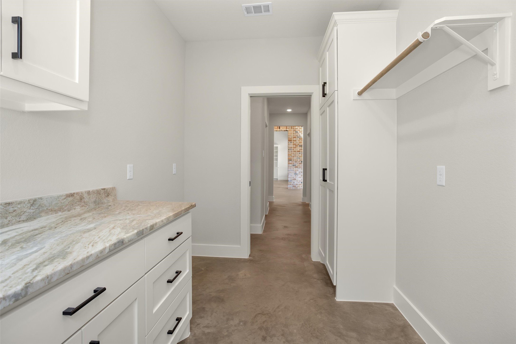 12744 Oak Barrel Road Willis, TX 77378 - Photo 38 of 50 Whether handling daily laundry or extra storage needs, this spacious utility room delivers convenience and organization without sacrificing style.