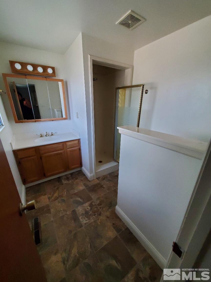 975 Bejay Place Reno, NV 89509 - Photo 25 of 33 a view of room with window and wooden floor