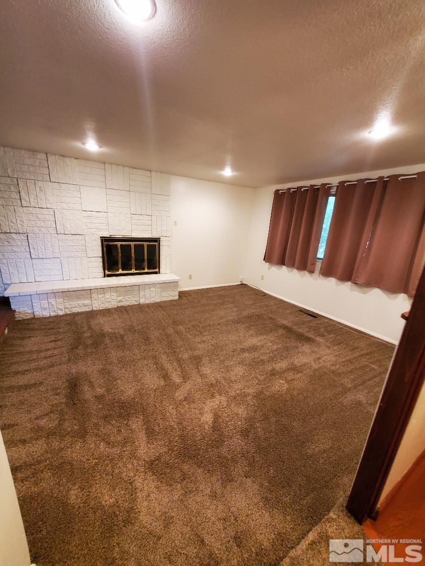 975 Bejay Place Reno, NV 89509 - Photo 26 of 33 a view of an empty room with kitchen