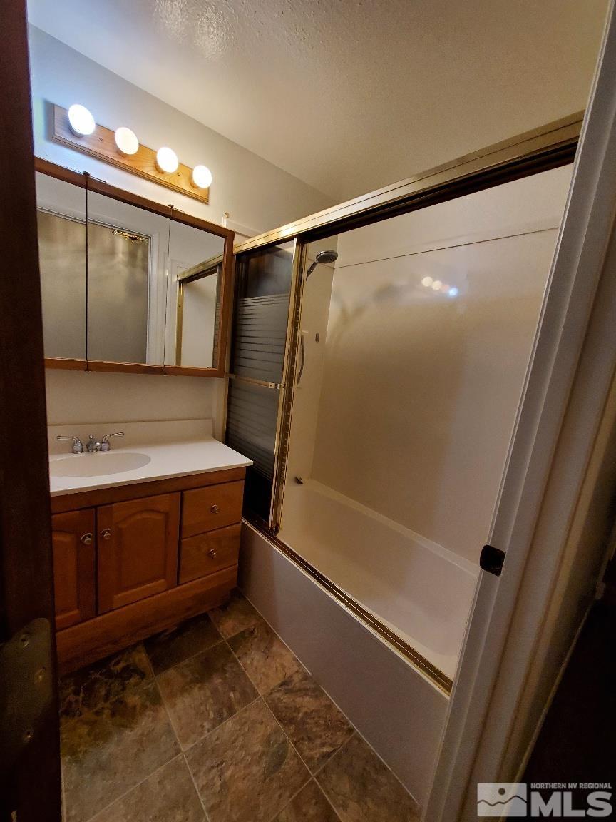 975 Bejay Place Reno, NV 89509 - Photo 29 of 33 a bathroom with a tub and a sink