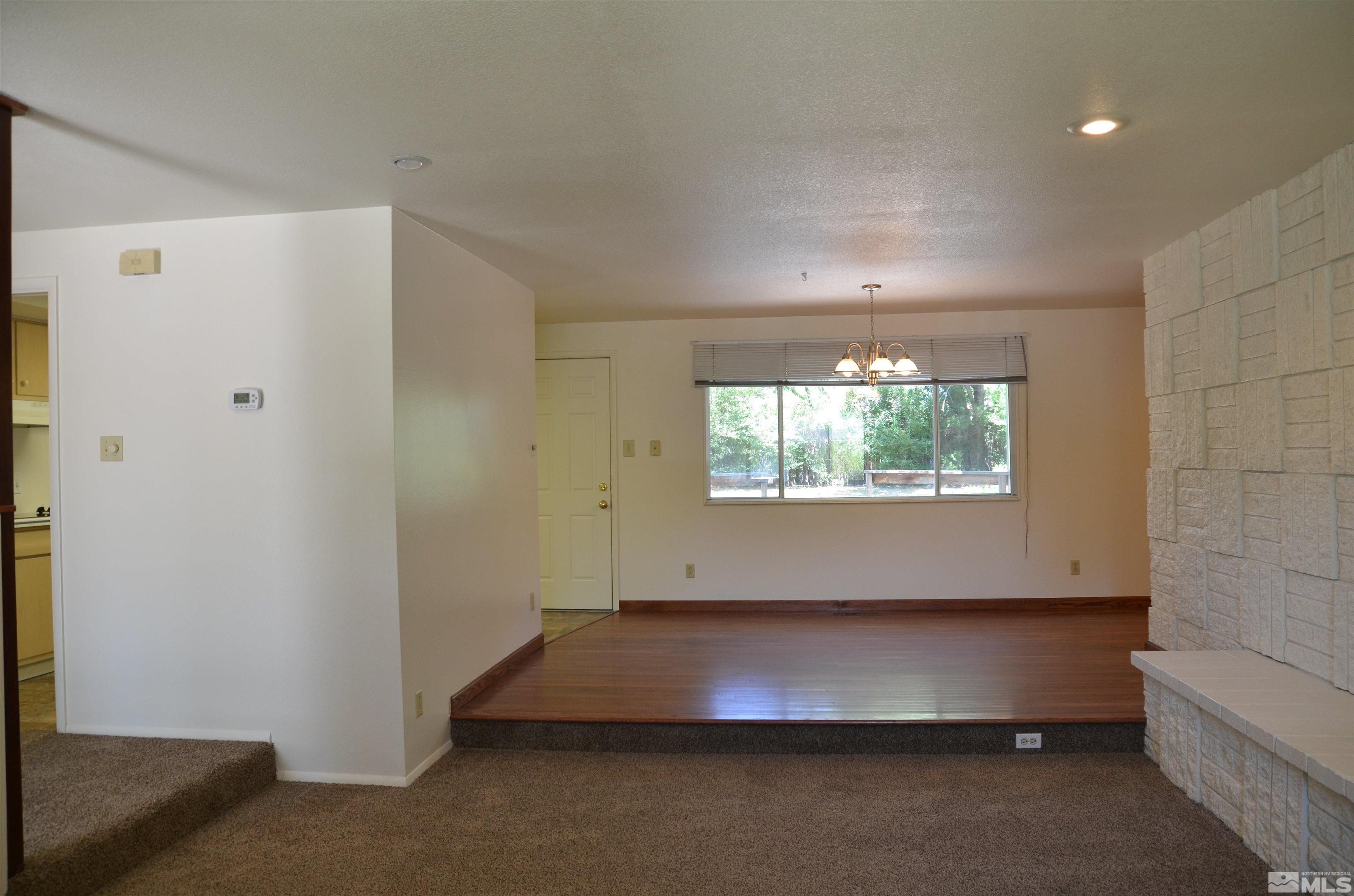 975 Bejay Place Reno, NV 89509 - Photo 4 of 33 an empty room with windows