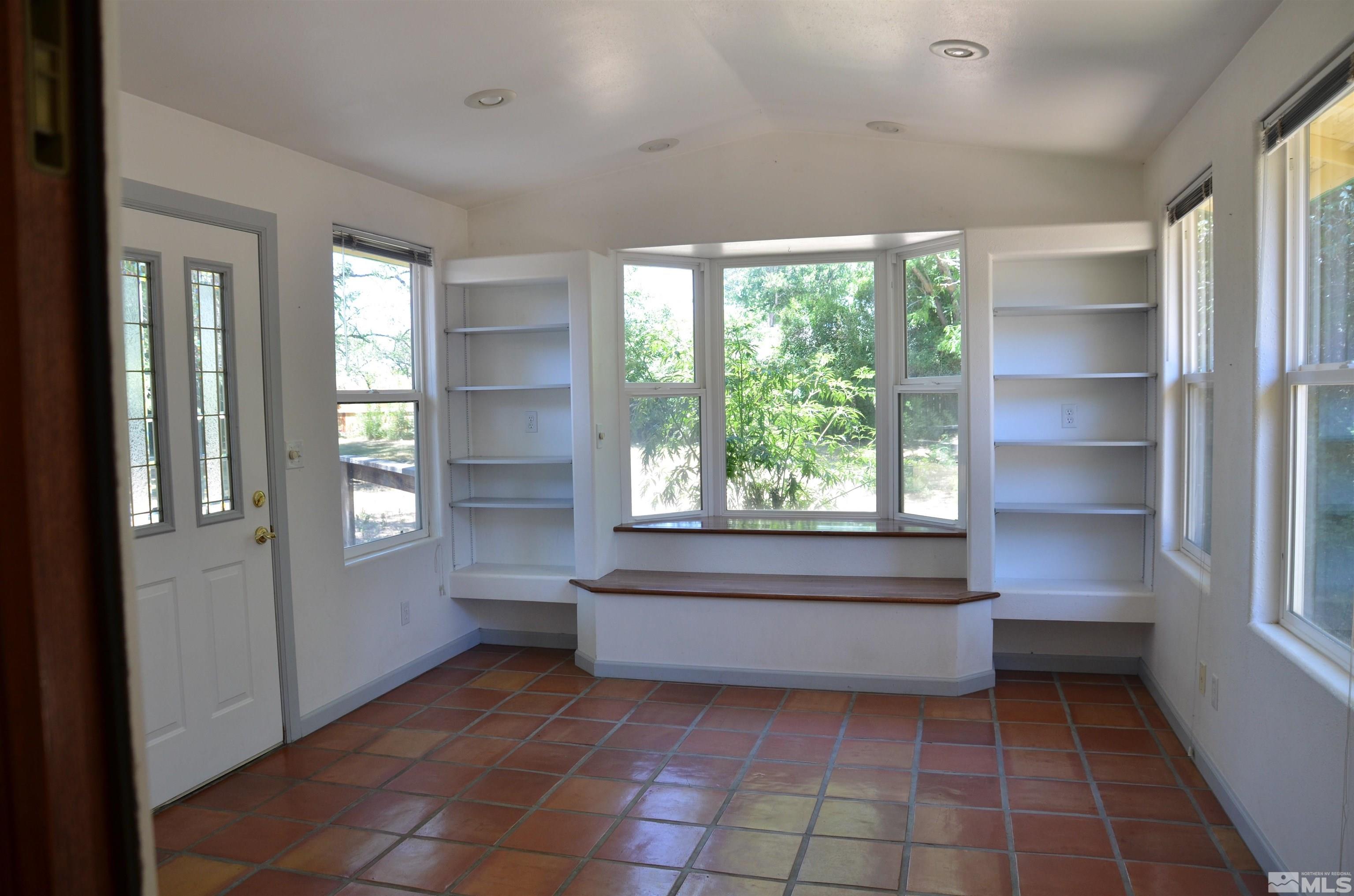 975 Bejay Place Reno, NV 89509 - Photo 5 of 33 a view of room with window and front door