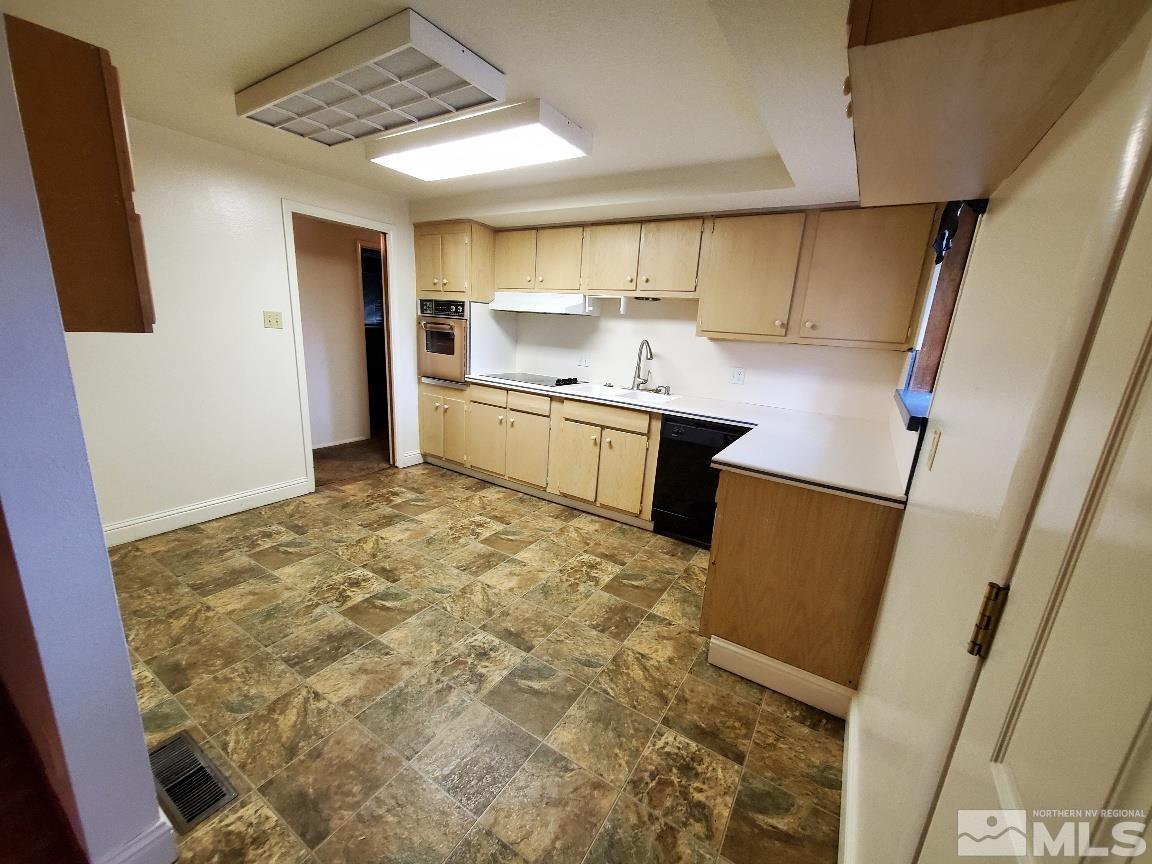 975 Bejay Place Reno, NV 89509 - Photo 8 of 33 a kitchen with stainless steel appliances a refrigerator and a sink