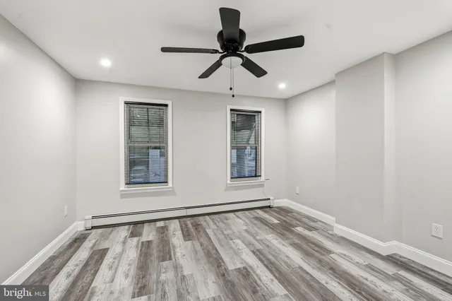a view of room with window and ceiling fan
