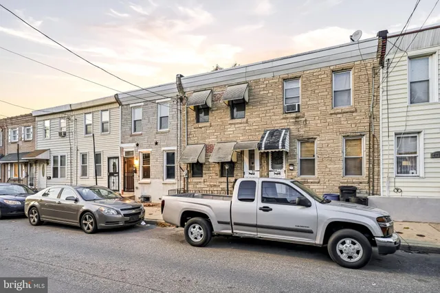 a car parked in front of a house
