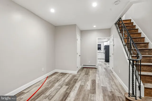 a view of entryway with wooden floor