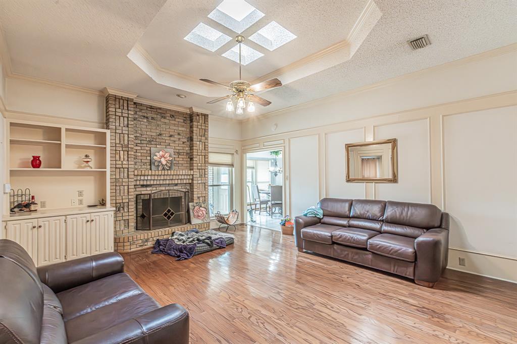 3309 Timber View Circle Bedford, TX 76021 - Photo 6 of 38 a living room with furniture fireplace and flat screen tv