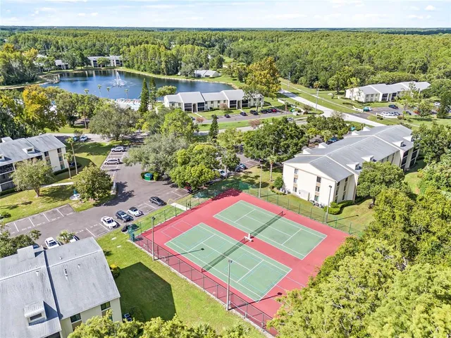 an aerial view of residential house with outdoor space and lake view