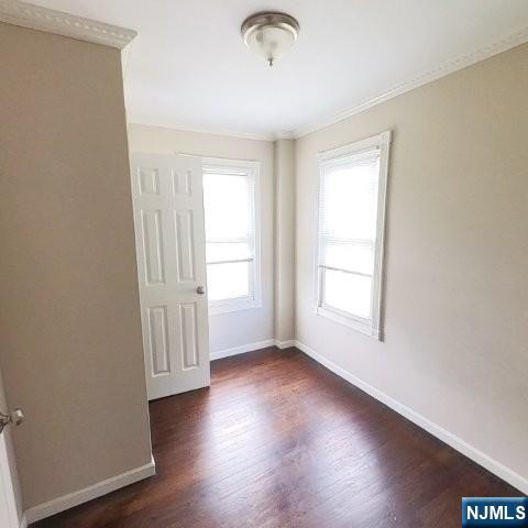 167 James Street Hackensack, NJ 07601 - Photo 22 of 30 an empty room with wooden floor and windows