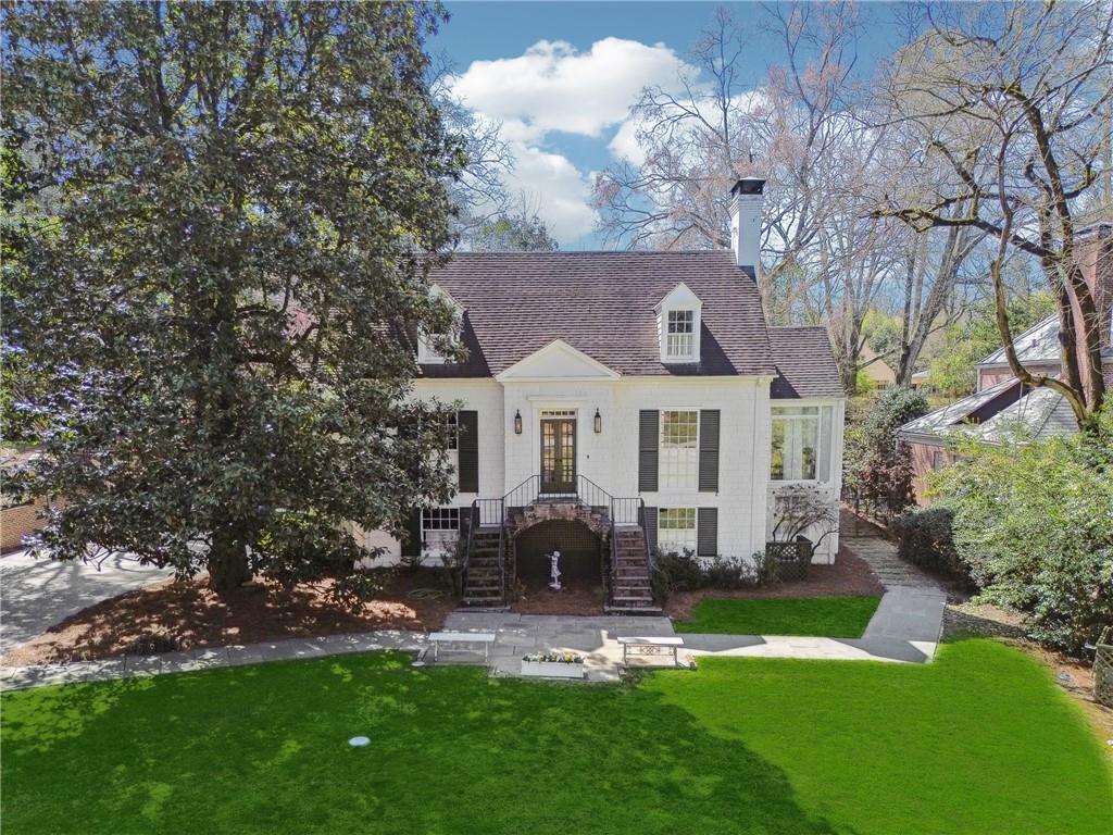 890 West Wesley Road Northwest Atlanta, GA 30327 - Photo 1 of 1 a front view of house with yard and green space