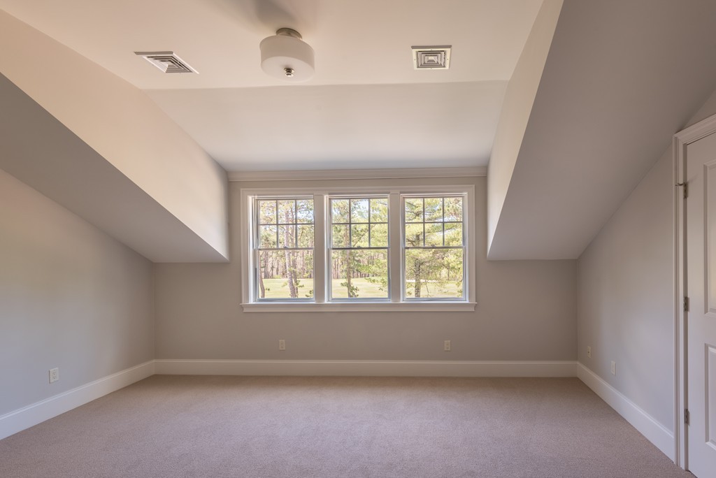 40 Clayton Circle, Unit A Mashpee, MA 02649 - Photo 11 of 12 an empty room with a window
