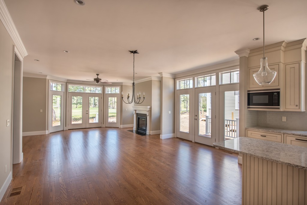 40 Clayton Circle, Unit A Mashpee, MA 02649 - Photo 6 of 12 a view of an empty room with wooden floor and a window