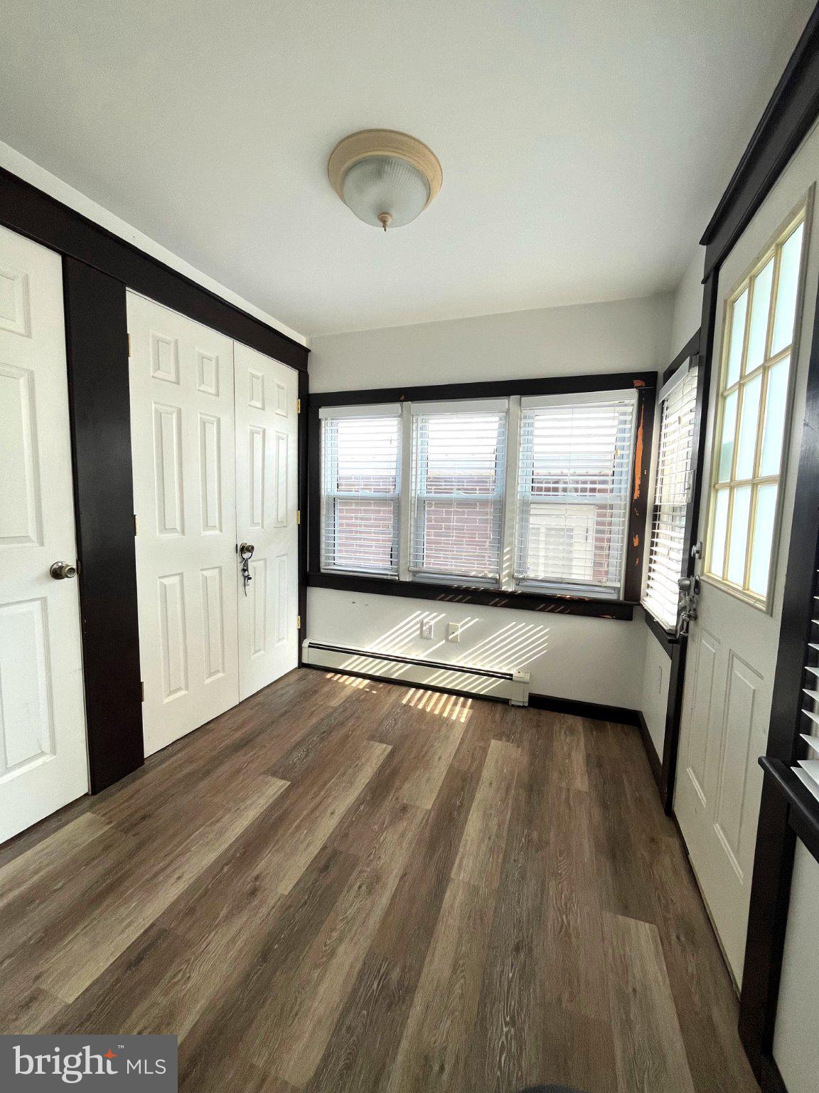 1660 Shimerville Road Emmaus, PA 18049 - Photo 12 of 26 wooden floor in an empty room with a window