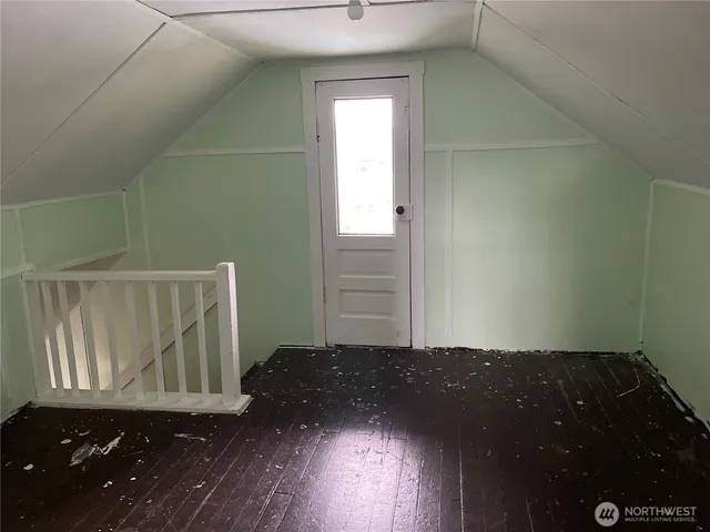 a view of entryway with wooden floor