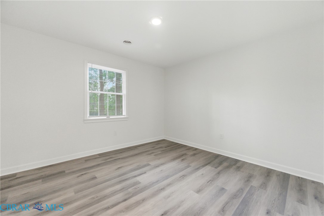 718 Dandy Loop Road Yorktown, VA 23692 - Photo 14 of 42 Empty room with light wood-style flooring and recessed lighting