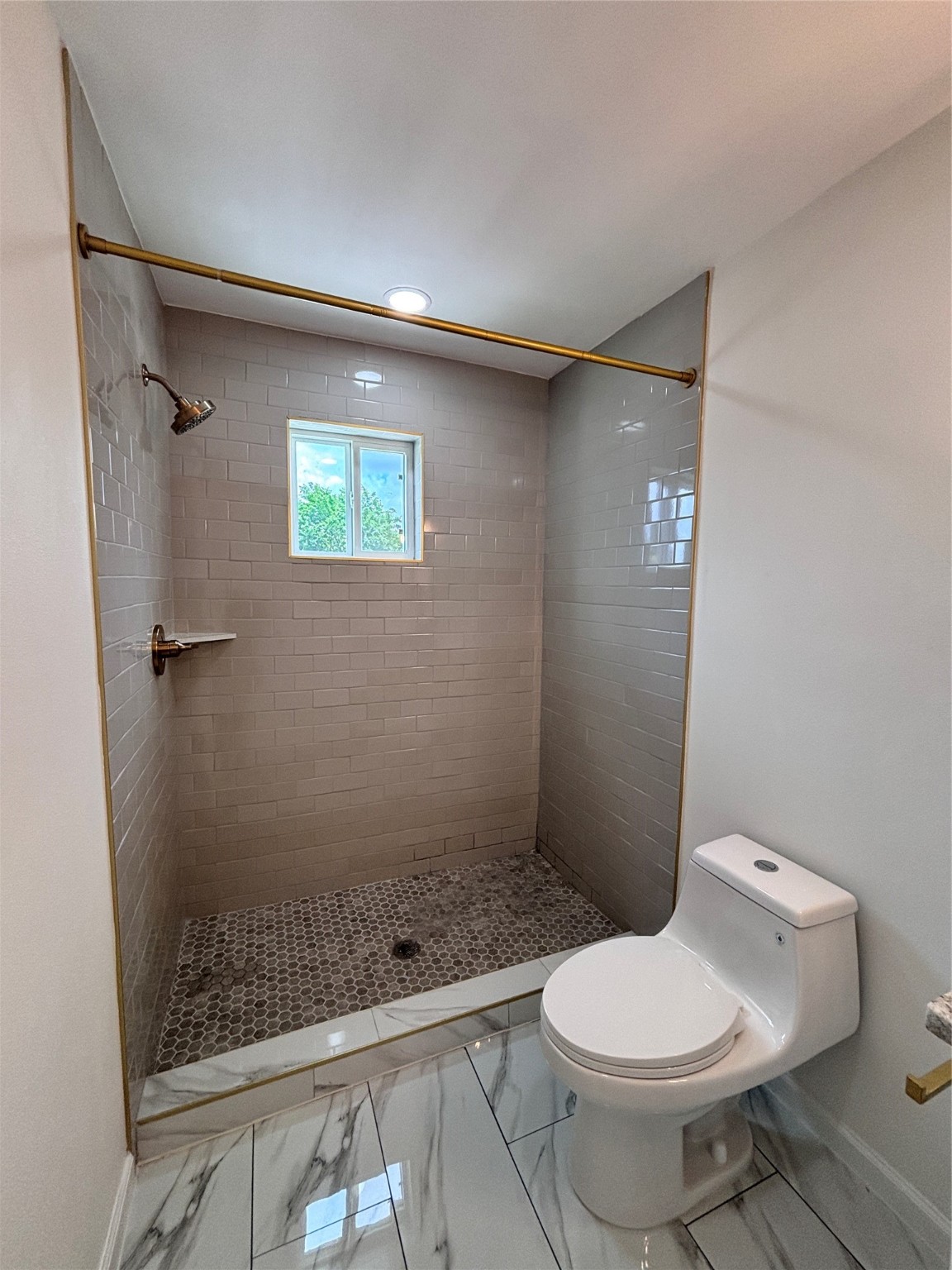 9913 Porto Rico Road, Unit B Houston, TX 77041 - Photo 12 of 26 a bathroom with a toilet and a shower