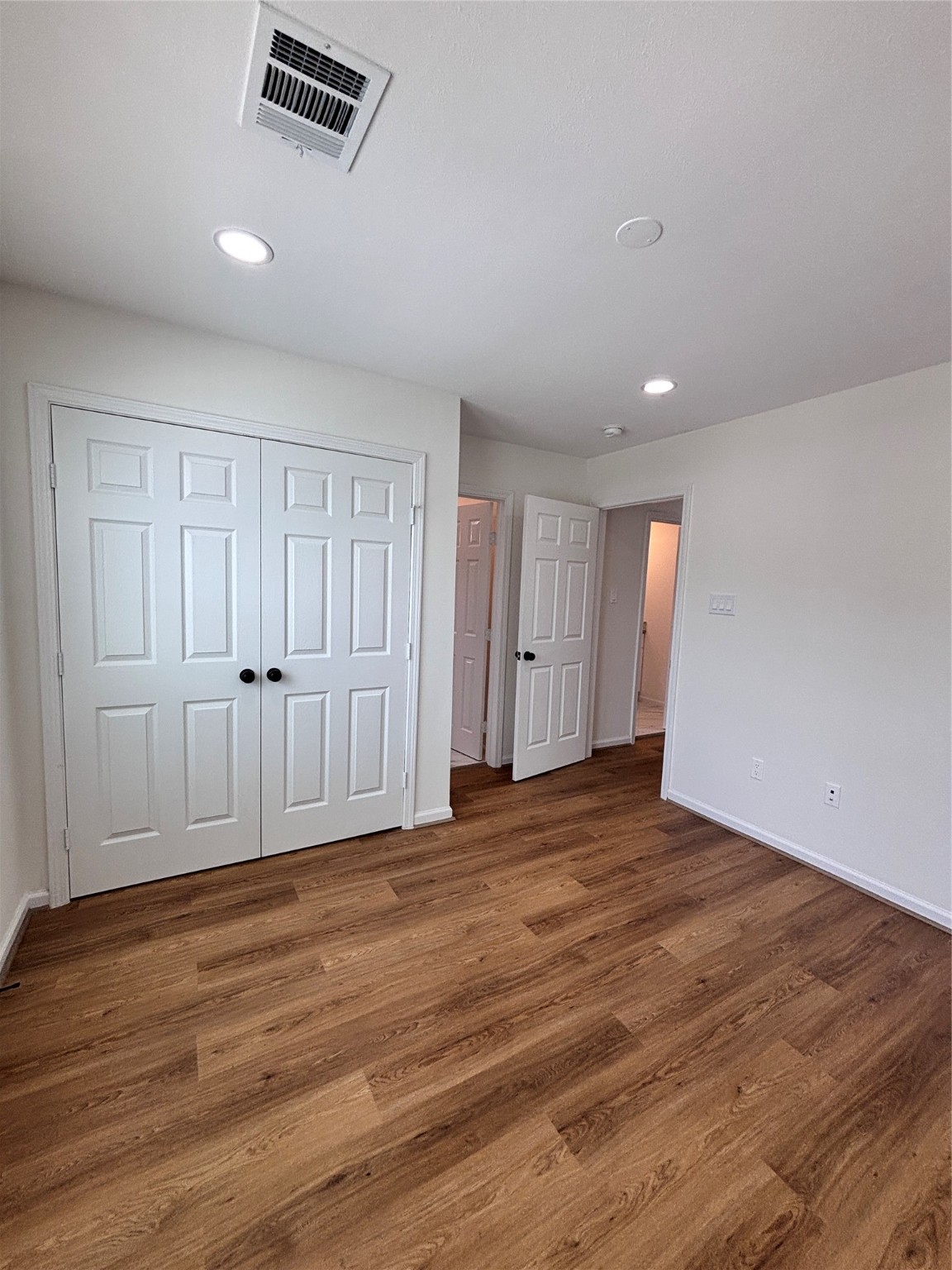 9913 Porto Rico Road, Unit B Houston, TX 77041 - Photo 14 of 26 a view of an empty room with wooden floor