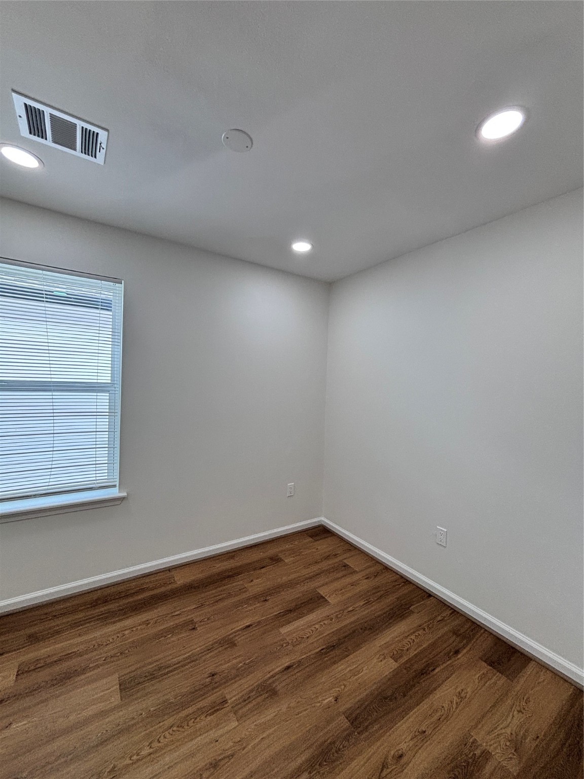 9913 Porto Rico Road, Unit B Houston, TX 77041 - Photo 18 of 26 a view of empty room with wooden floor