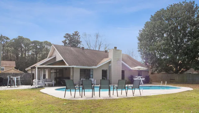 a view of a house with a backyard